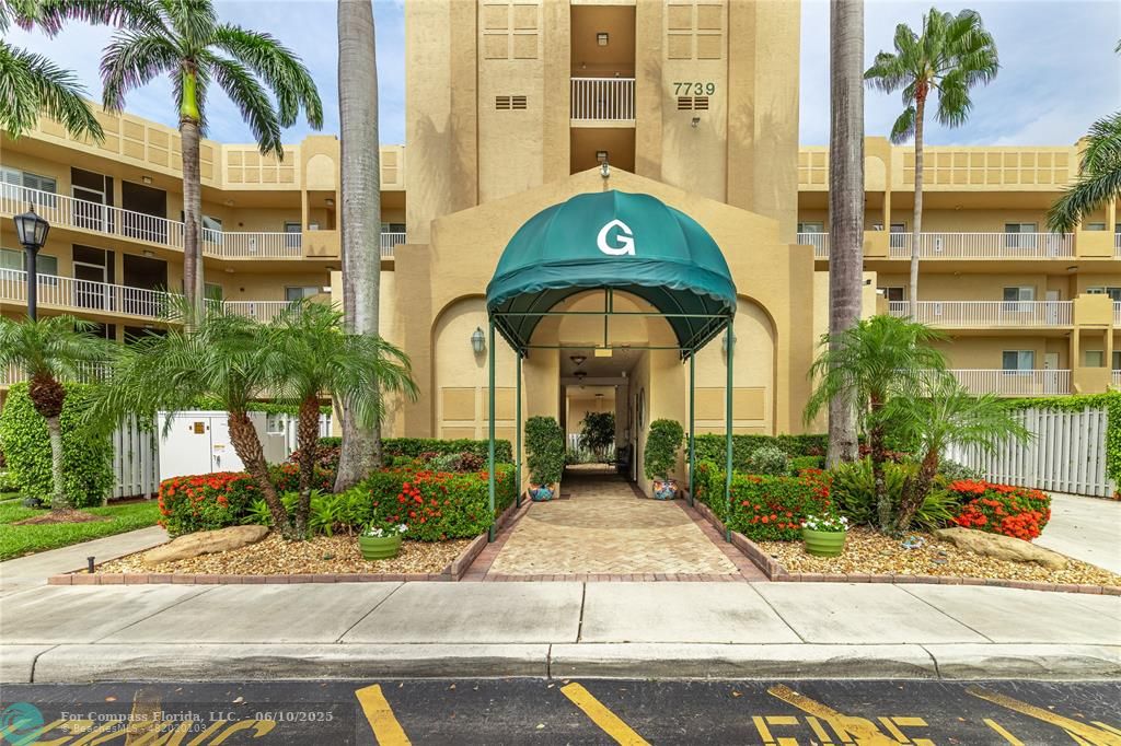 7739 Southampton Terrace, Unit 202 Tamarac, FL 33321 - Photo 1 of 39 a front view of a building with a garden