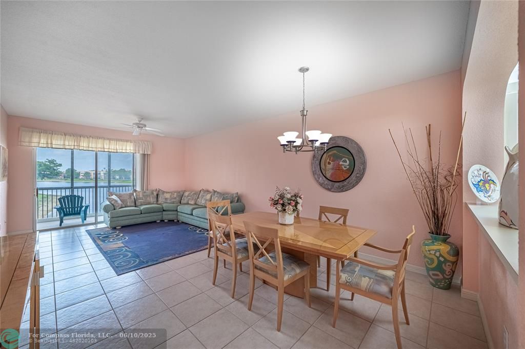 7739 Southampton Terrace, Unit 202 Tamarac, FL 33321 - Photo 14 of 39 a view of a workspace with furniture and a large window