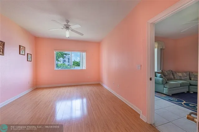 a view of a livingroom with furniture stairs and bedroom view