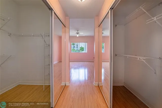 a view of gallery with wooden floor