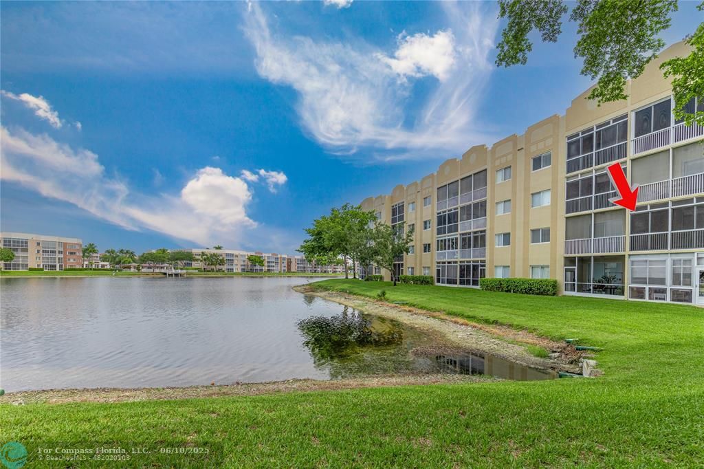 7739 Southampton Terrace, Unit 202 Tamarac, FL 33321 - Photo 22 of 39 a view of a house with a yard and a fountain