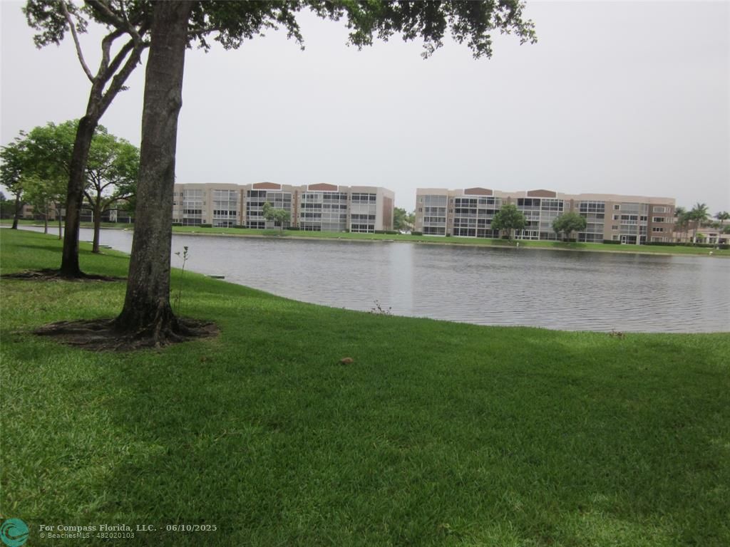 7739 Southampton Terrace, Unit 202 Tamarac, FL 33321 - Photo 23 of 39 a view of a lake with a city