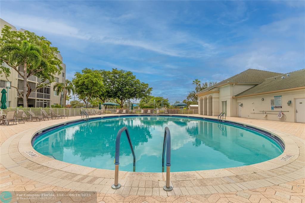 7739 Southampton Terrace, Unit 202 Tamarac, FL 33321 - Photo 26 of 39 a view of a swimming pool with a patio
