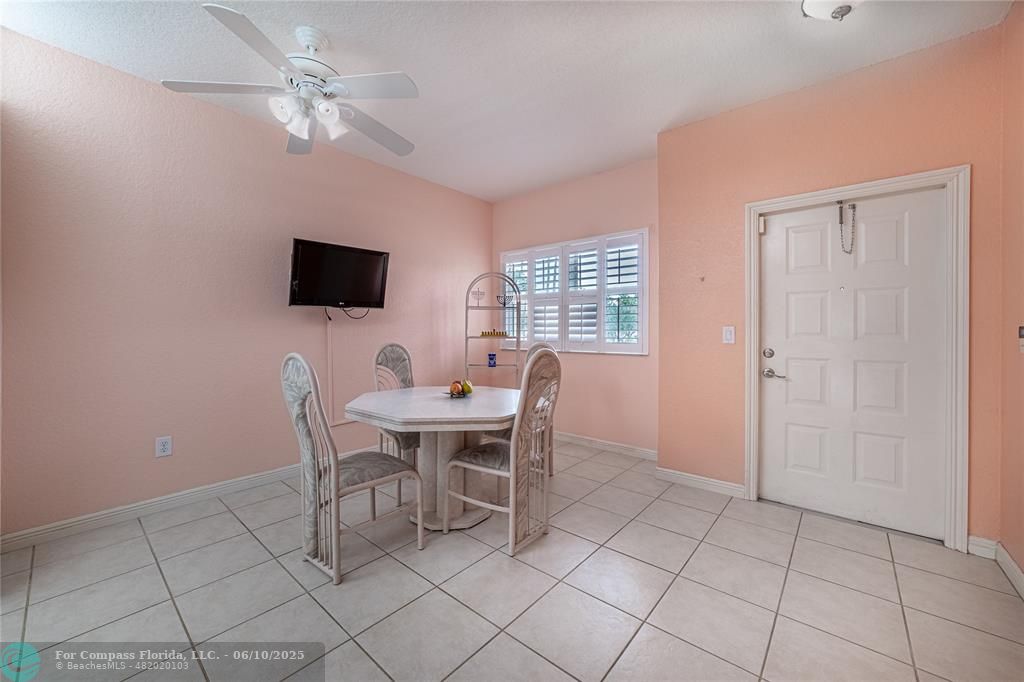 7739 Southampton Terrace, Unit 202 Tamarac, FL 33321 - Photo 3 of 39 a work room with furniture and a flat screen tv