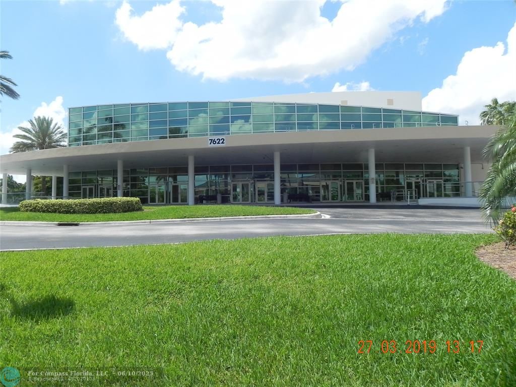 7739 Southampton Terrace, Unit 202 Tamarac, FL 33321 - Photo 38 of 39 a view of a building with a swimming pool