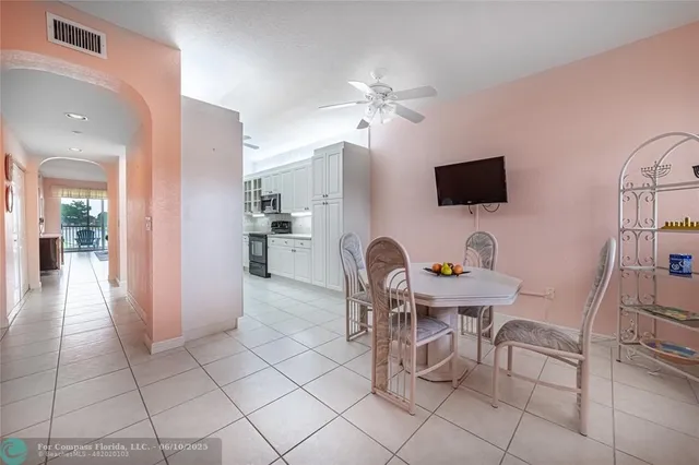 a view of a livingroom with furniture and a flat screen tv