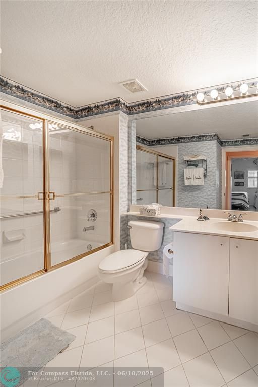 7739 Southampton Terrace, Unit 202 Tamarac, FL 33321 - Photo 9 of 39 a spacious bathroom with a granite countertop sink toilet a mirror and shower