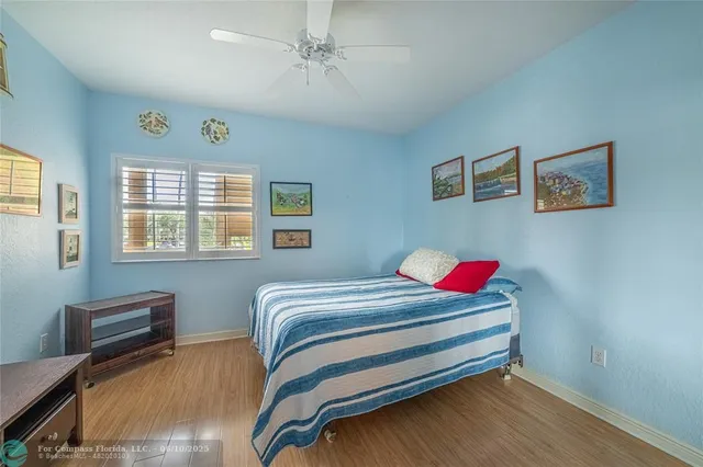 a bedroom with furniture and a window