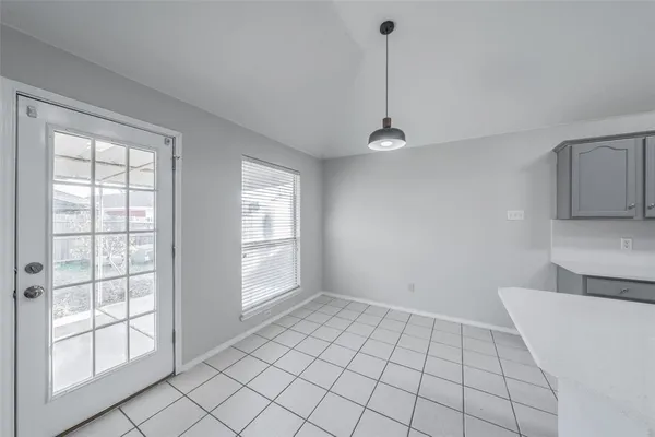 a view of an empty room with a window