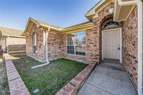 a view of a house with stairs and a yard