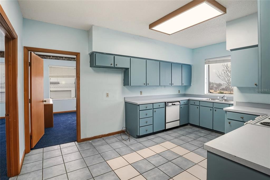 1803 3rd Street Southwest Winter Haven, FL 33880 - Photo 20 of 66 a kitchen with a cabinets and appliances