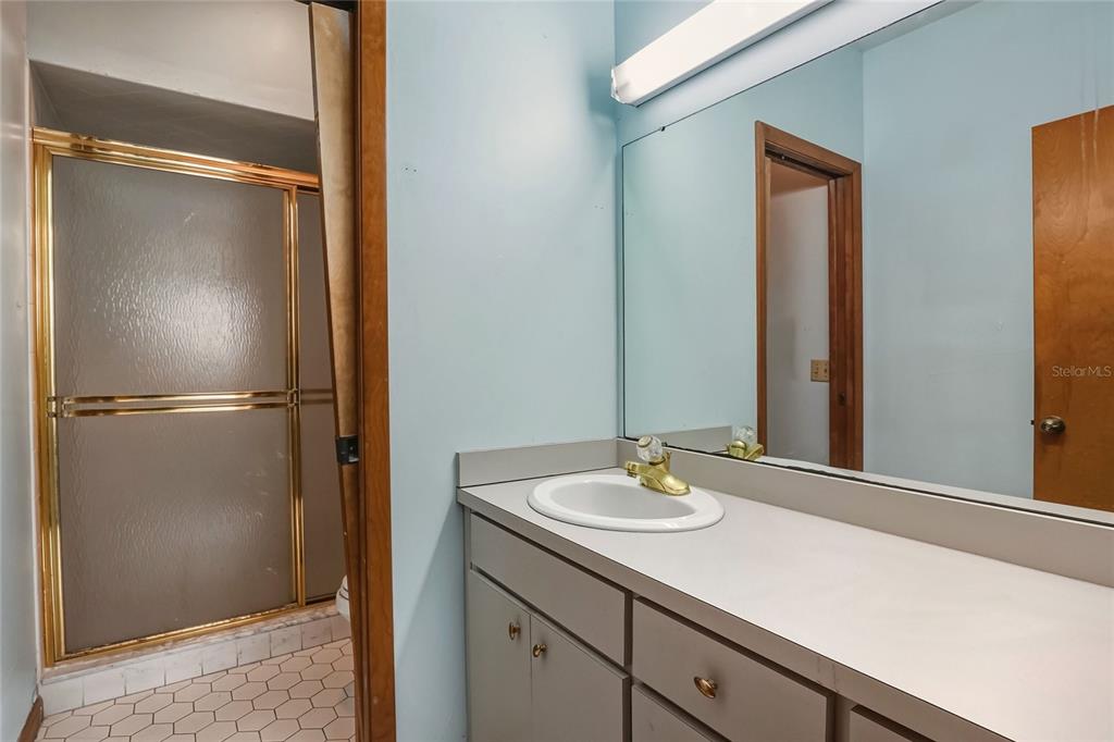 1803 3rd Street Southwest Winter Haven, FL 33880 - Photo 24 of 66 a bathroom with a sink and mirror