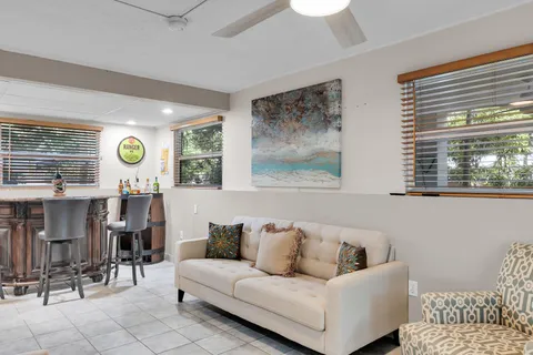 a bathroom with a sink and mirror with toilet