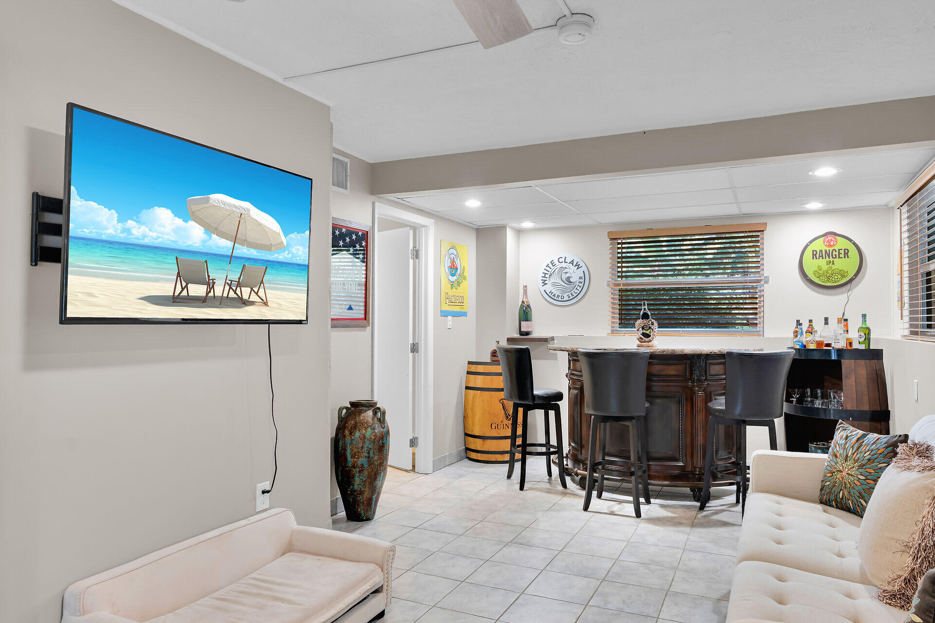 593 Bonito Avenue Key Largo, FL 33037 - Photo 12 of 72 a living room with furniture a chandelier and a large window