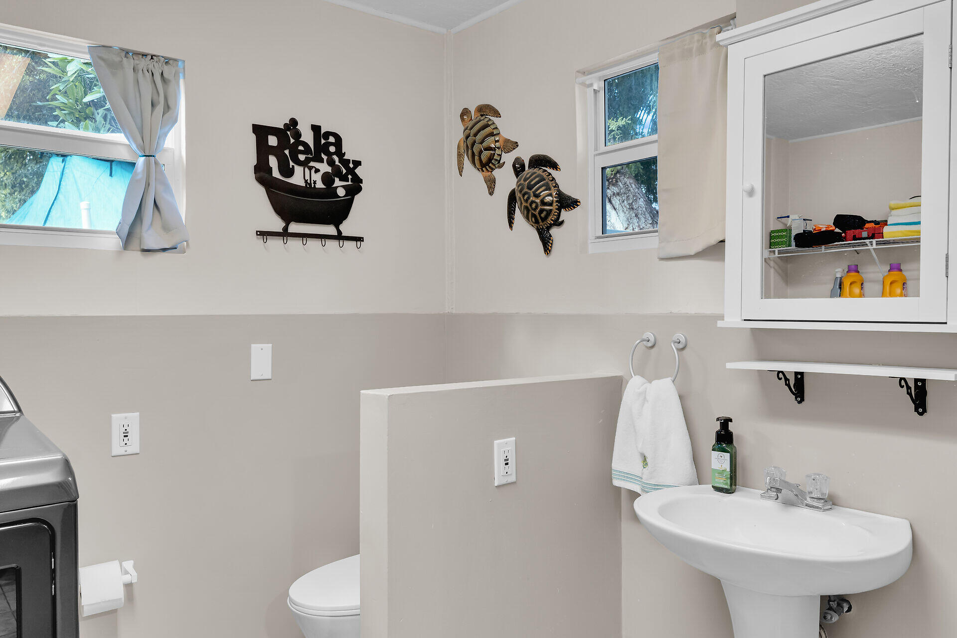 593 Bonito Avenue Key Largo, FL 33037 - Photo 15 of 72 a bathroom with a sink and mirror with toilet