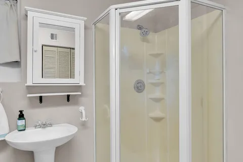 a kitchen with granite countertop a refrigerator and a sink