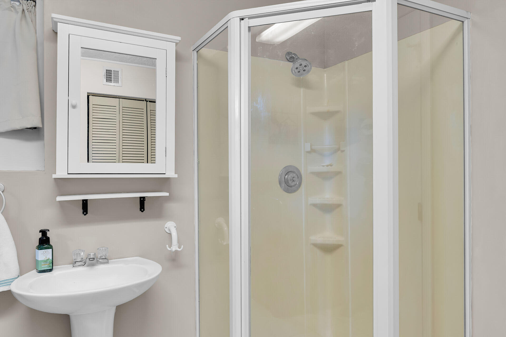 593 Bonito Avenue Key Largo, FL 33037 - Photo 17 of 72 a bathroom with a sink a mirror and a shower