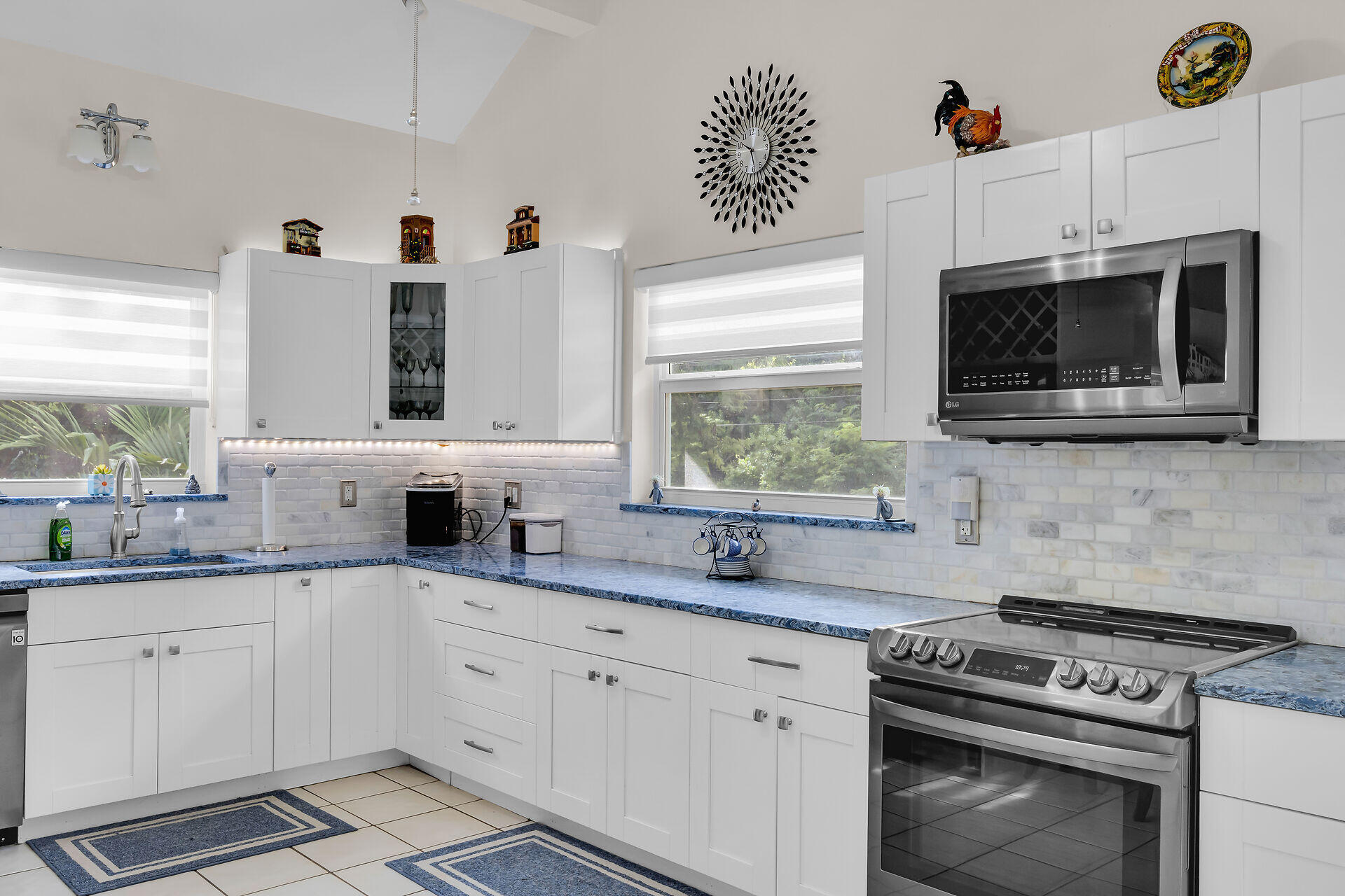 593 Bonito Avenue Key Largo, FL 33037 - Photo 21 of 72 a kitchen with granite countertop a stove a sink and a microwave