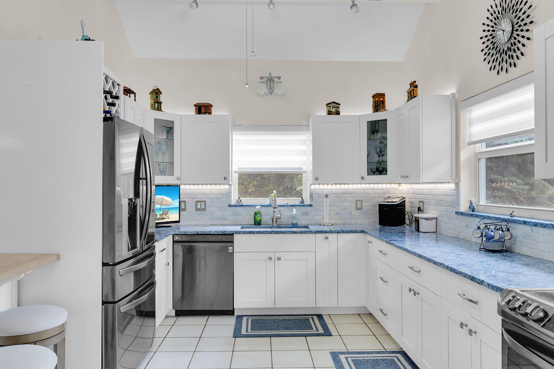 593 Bonito Avenue Key Largo, FL 33037 - Photo 22 of 72 a kitchen with a sink stove and cabinets