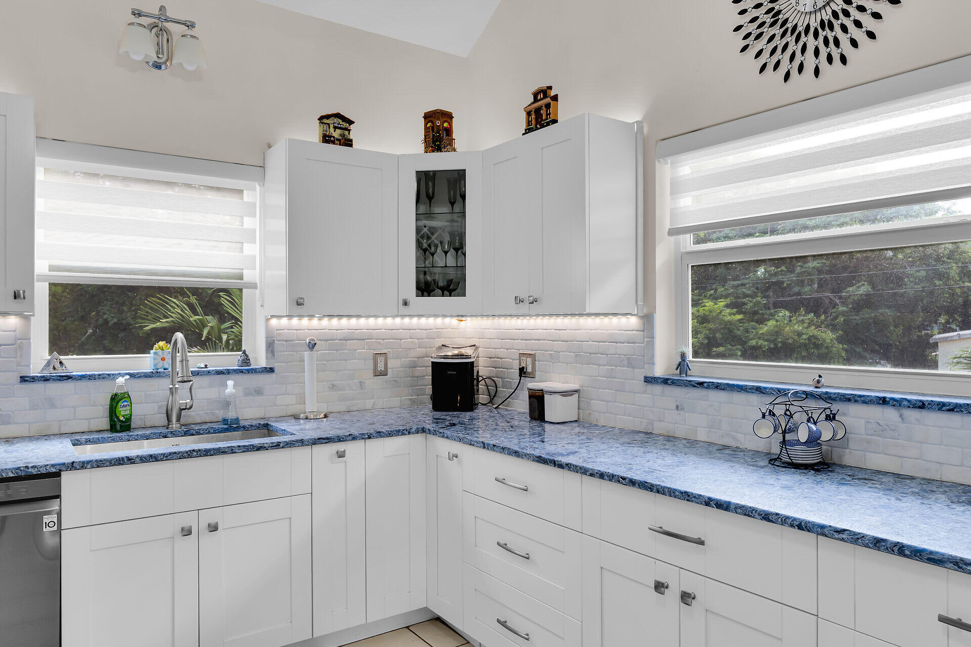593 Bonito Avenue Key Largo, FL 33037 - Photo 23 of 72 a kitchen with granite countertop white cabinets and window