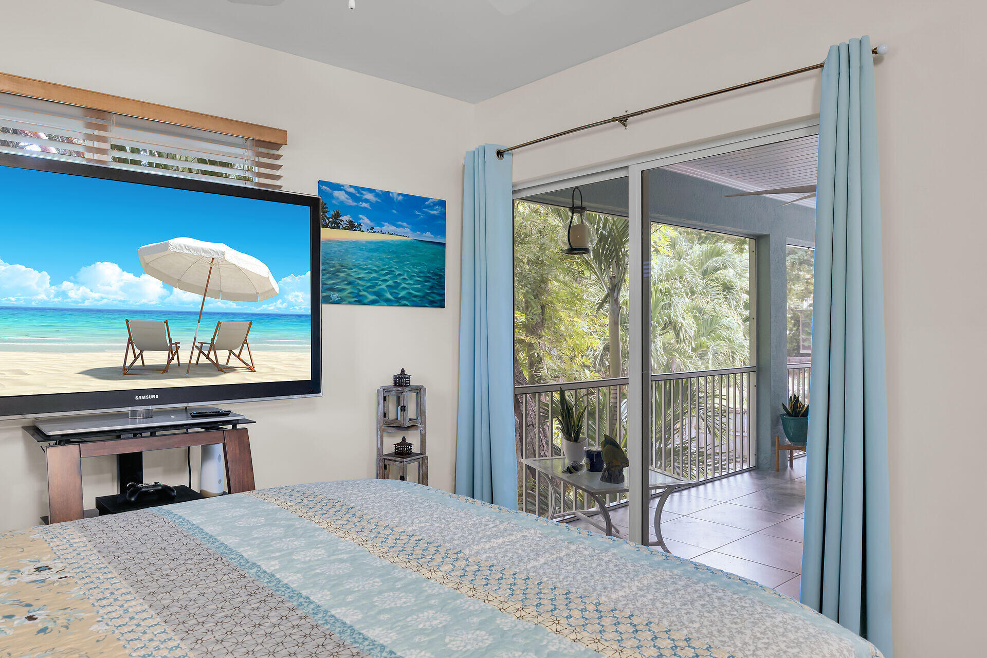 593 Bonito Avenue Key Largo, FL 33037 - Photo 29 of 72 a bedroom with a bed and a flat screen tv
