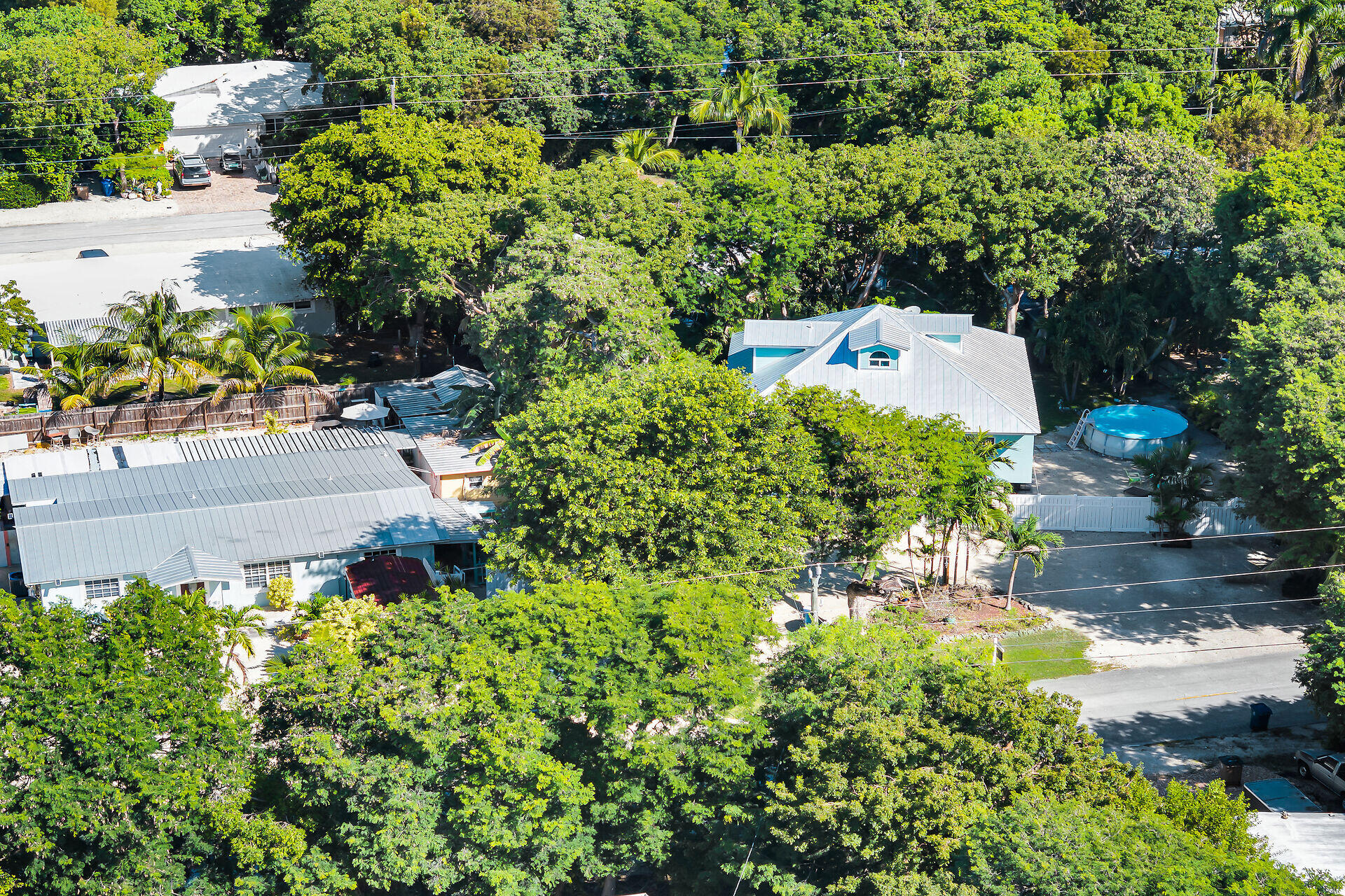 593 Bonito Avenue Key Largo, FL 33037 - Photo 3 of 72 an aerial view of a house with a yard and garden