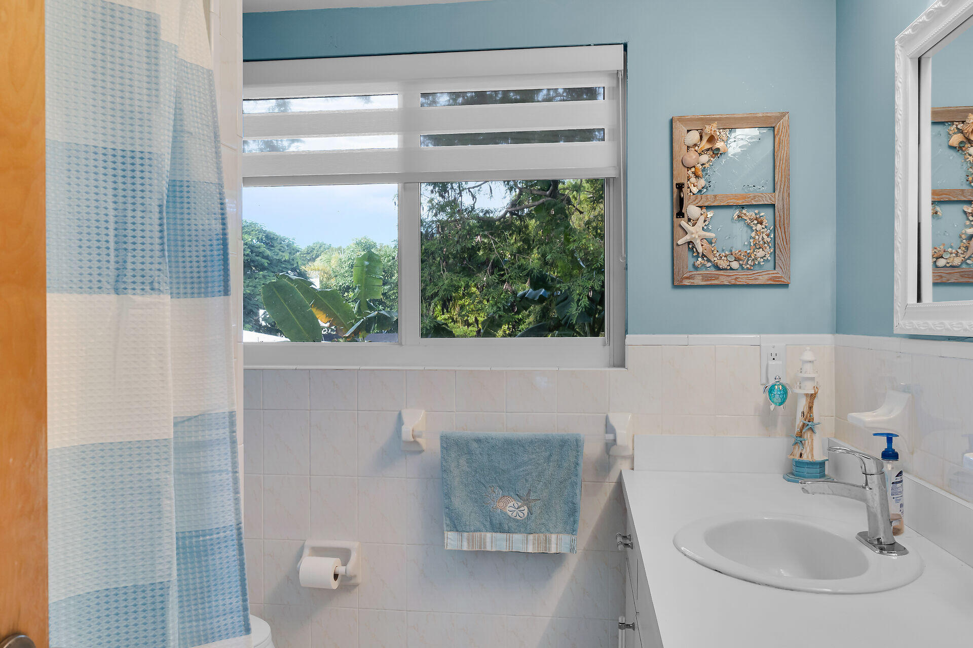 593 Bonito Avenue Key Largo, FL 33037 - Photo 34 of 72 a bathroom with a sink and a large window