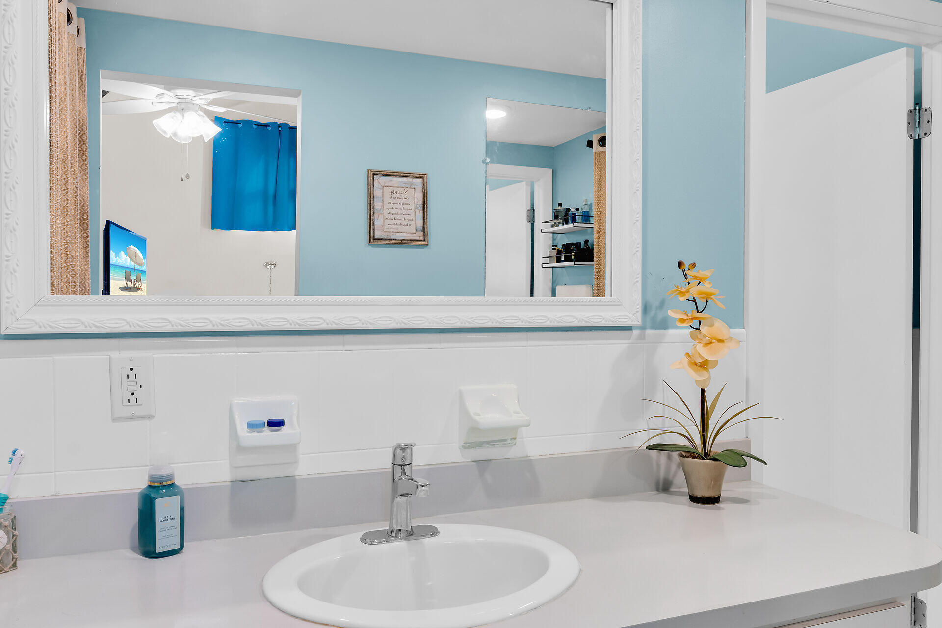 593 Bonito Avenue Key Largo, FL 33037 - Photo 43 of 72 a bathroom with a sink a mirror and vanity