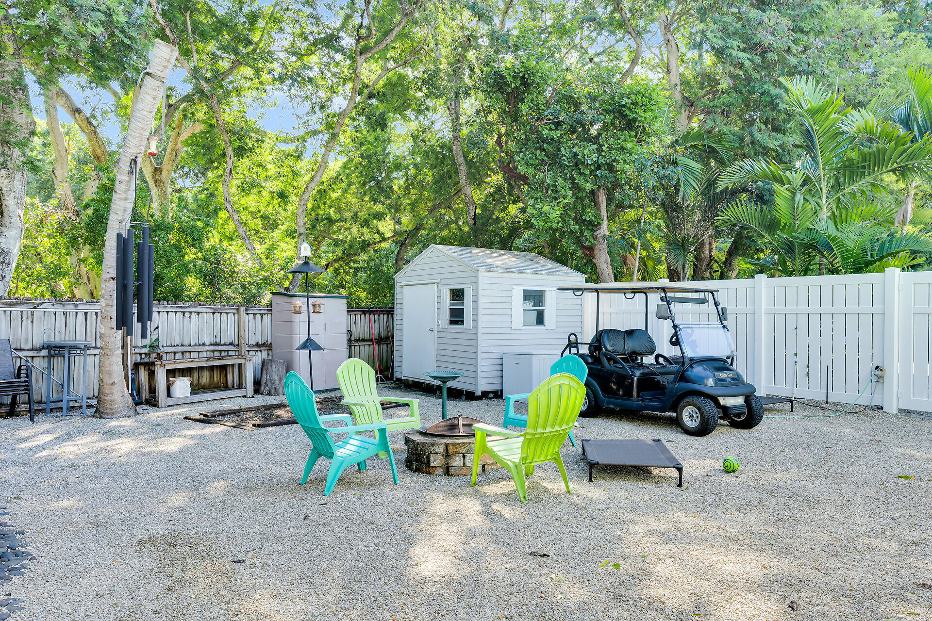593 Bonito Avenue Key Largo, FL 33037 - Photo 55 of 72 a view of backyard with a table and chairs