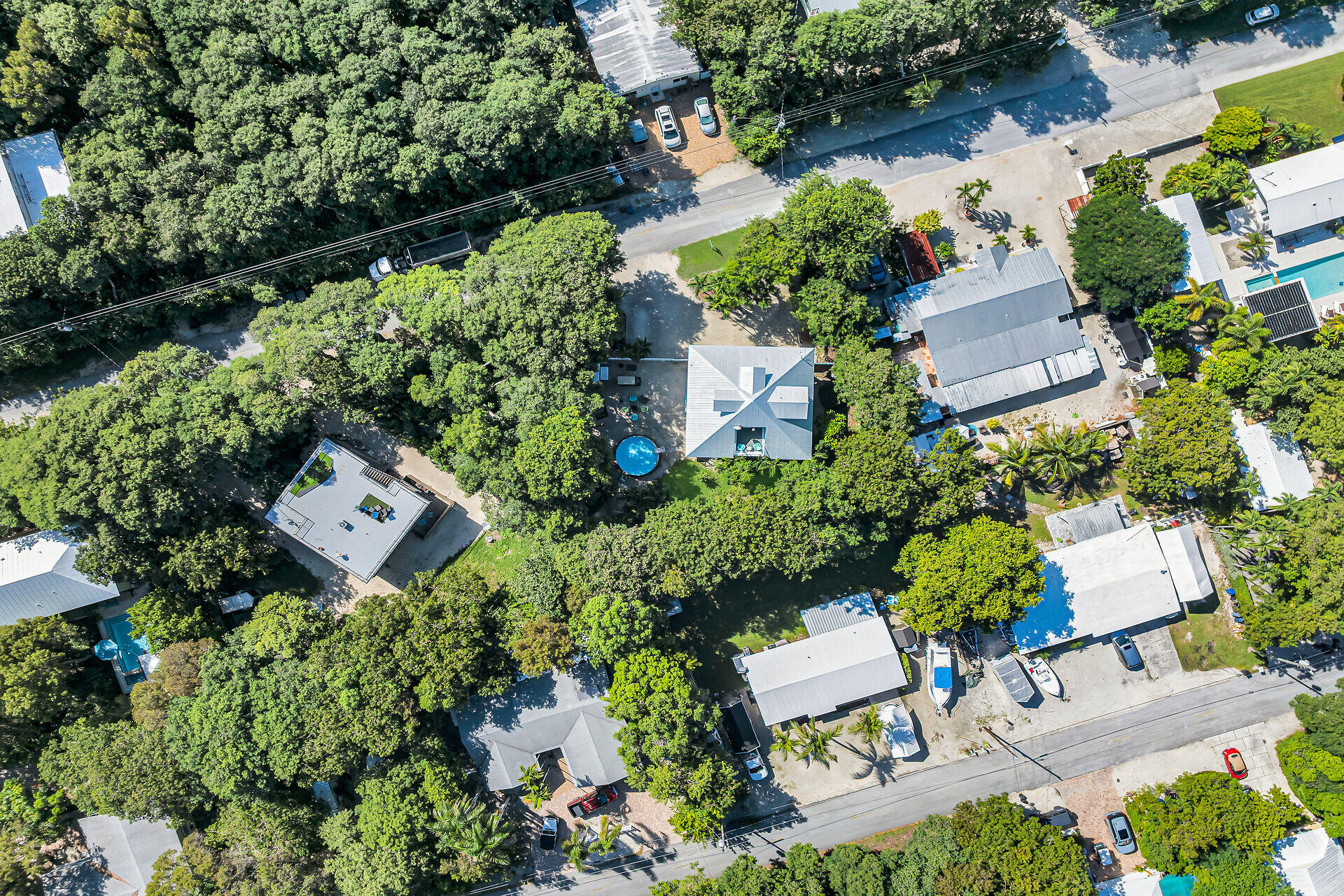 593 Bonito Avenue Key Largo, FL 33037 - Photo 65 of 72 an aerial view of a house with a yard and lake view