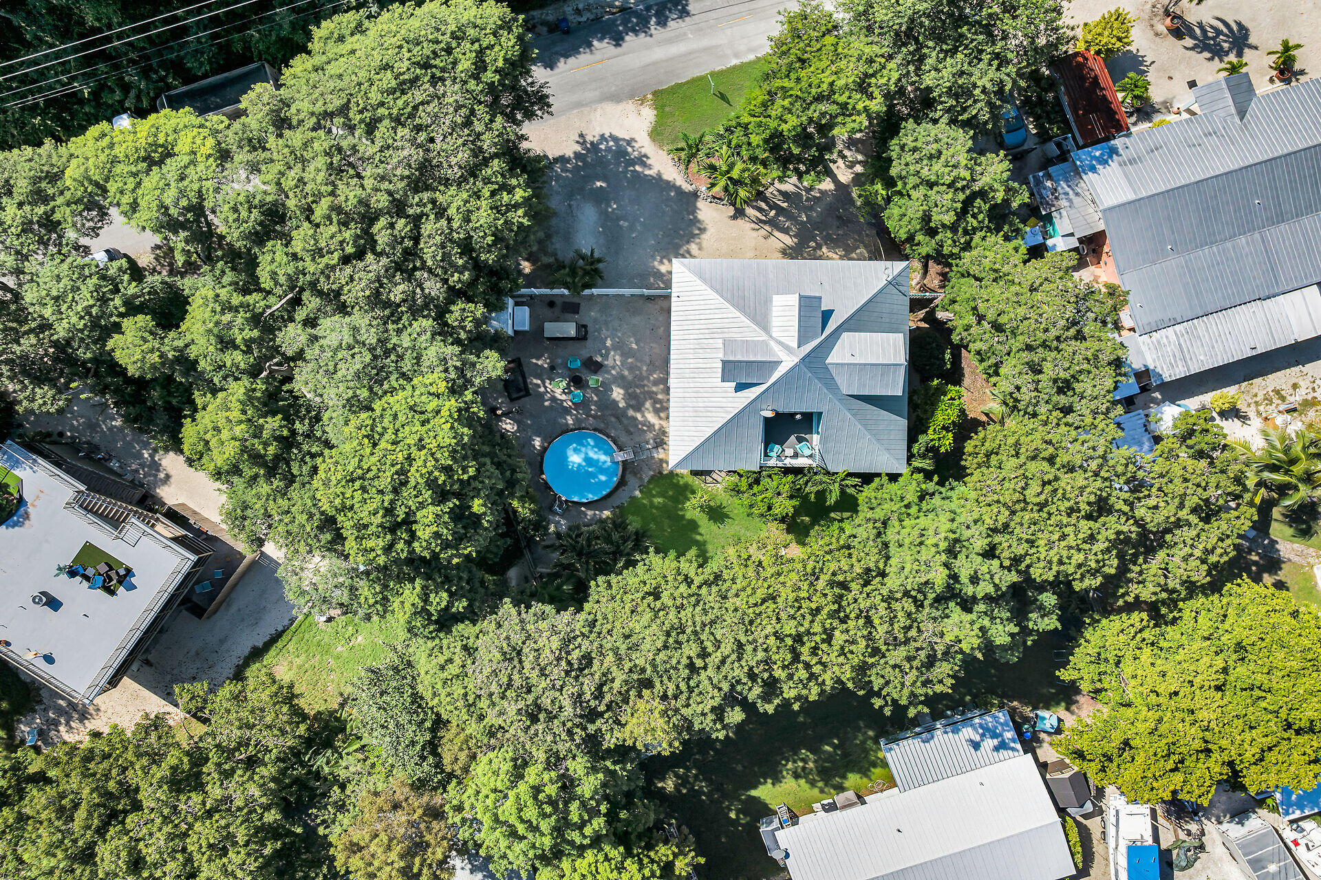 593 Bonito Avenue Key Largo, FL 33037 - Photo 70 of 72 an aerial view of a house with a yard and garden