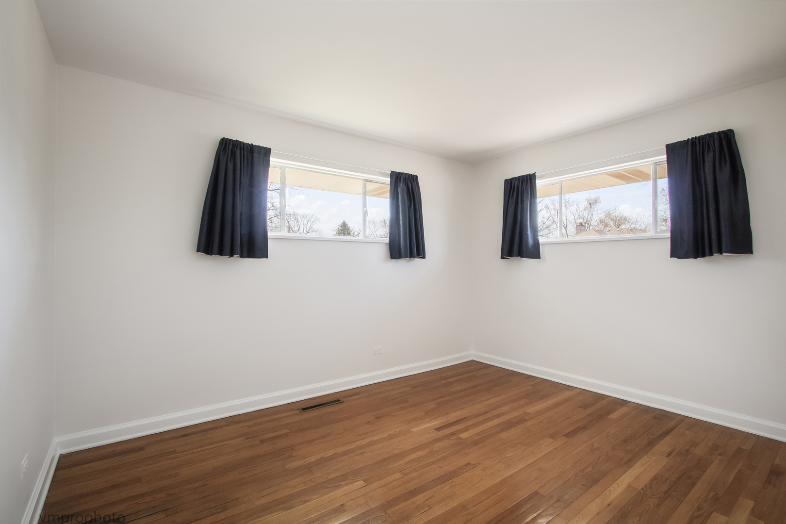 61 Miller Road Lake Zurich, IL 60047 - Photo 13 of 31 a view of empty room with wooden floor and fan