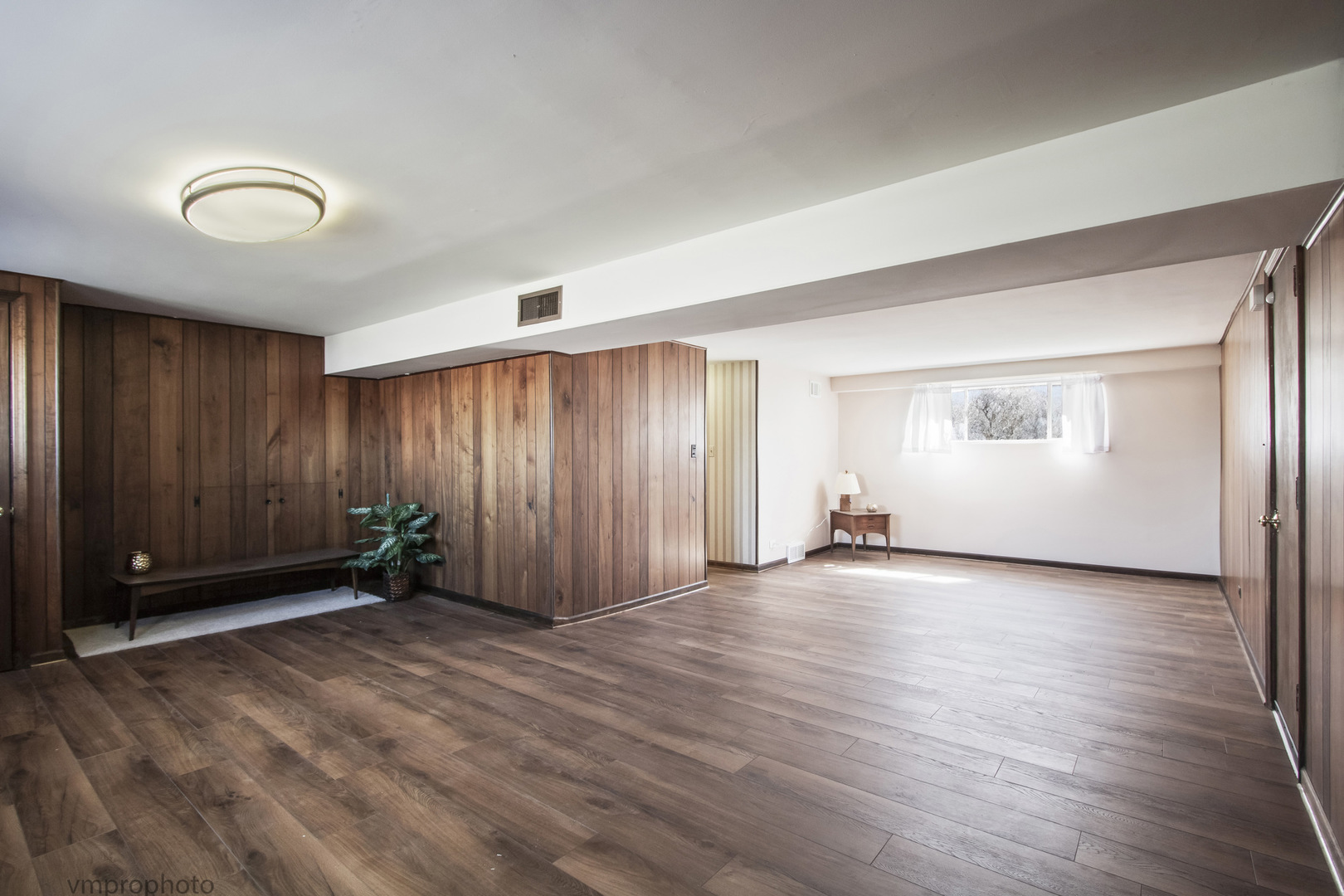 61 Miller Road Lake Zurich, IL 60047 - Photo 17 of 31 an empty room with wooden floor and windows