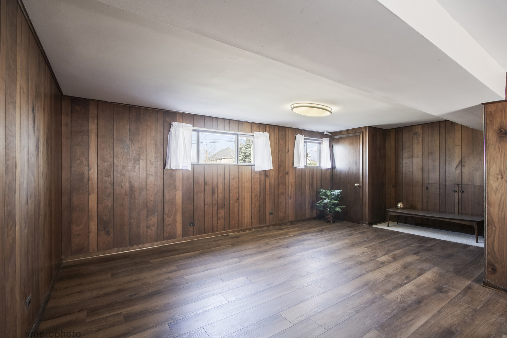 61 Miller Road Lake Zurich, IL 60047 - Photo 18 of 31 an empty room with wooden floor and windows