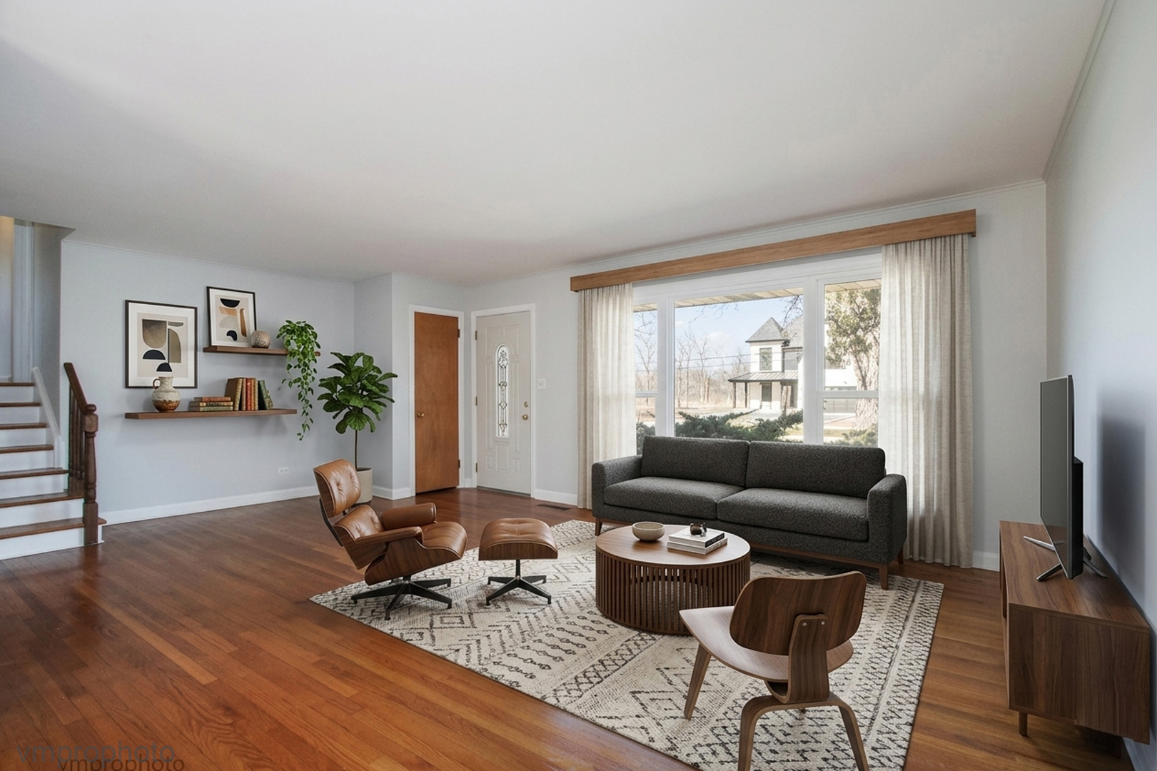 61 Miller Road Lake Zurich, IL 60047 - Photo 2 of 31 a living room with furniture rug and a window