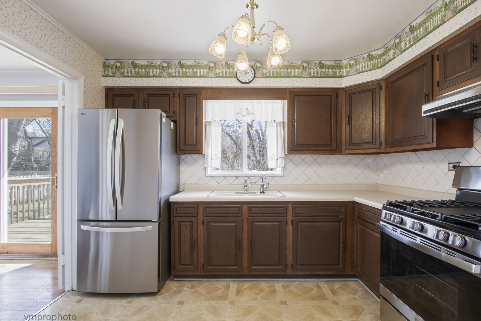 61 Miller Road Lake Zurich, IL 60047 - Photo 7 of 31 a kitchen with stainless steel appliances a sink stove and refrigerator