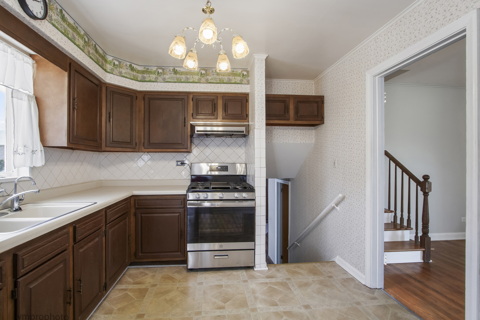 61 Miller Road Lake Zurich, IL 60047 - Photo 8 of 31 a kitchen with stainless steel appliances granite countertop a stove and a sink