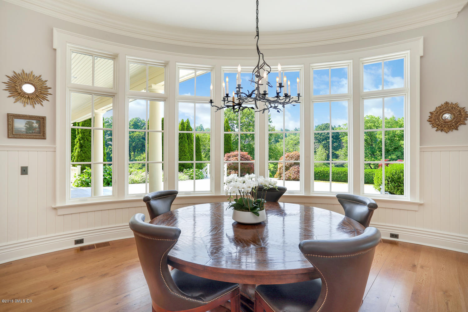 35 Close Road Greenwich, CT 06831 - Photo 18 of 78 a dining room with furniture a chandelier and wooden floor