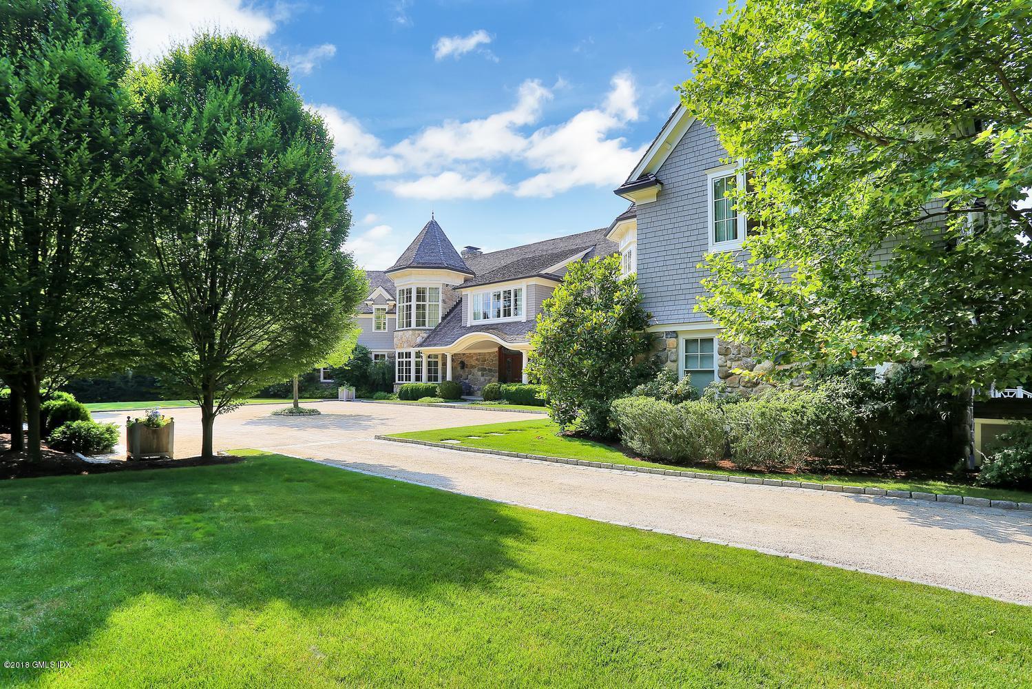 35 Close Road Greenwich, CT 06831 - Photo 2 of 78 a view of a house with a swimming pool and a yard
