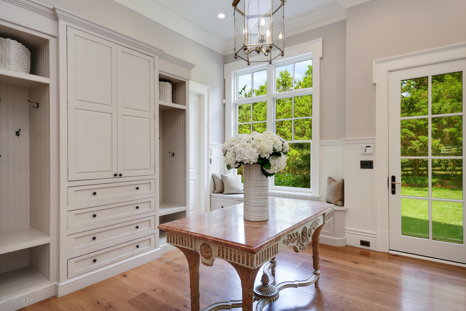 35 Close Road Greenwich, CT 06831 - Photo 28 of 78 a view of a dining room with furniture window and wooden floor