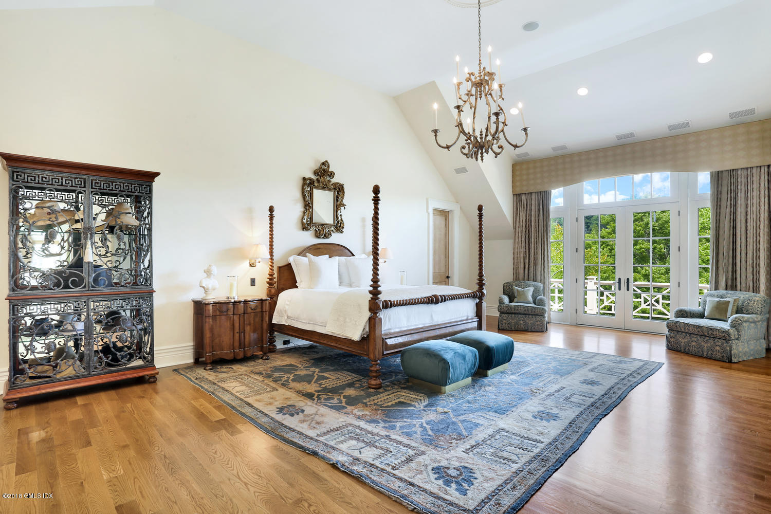 35 Close Road Greenwich, CT 06831 - Photo 34 of 78 a living room with furniture and a chandelier