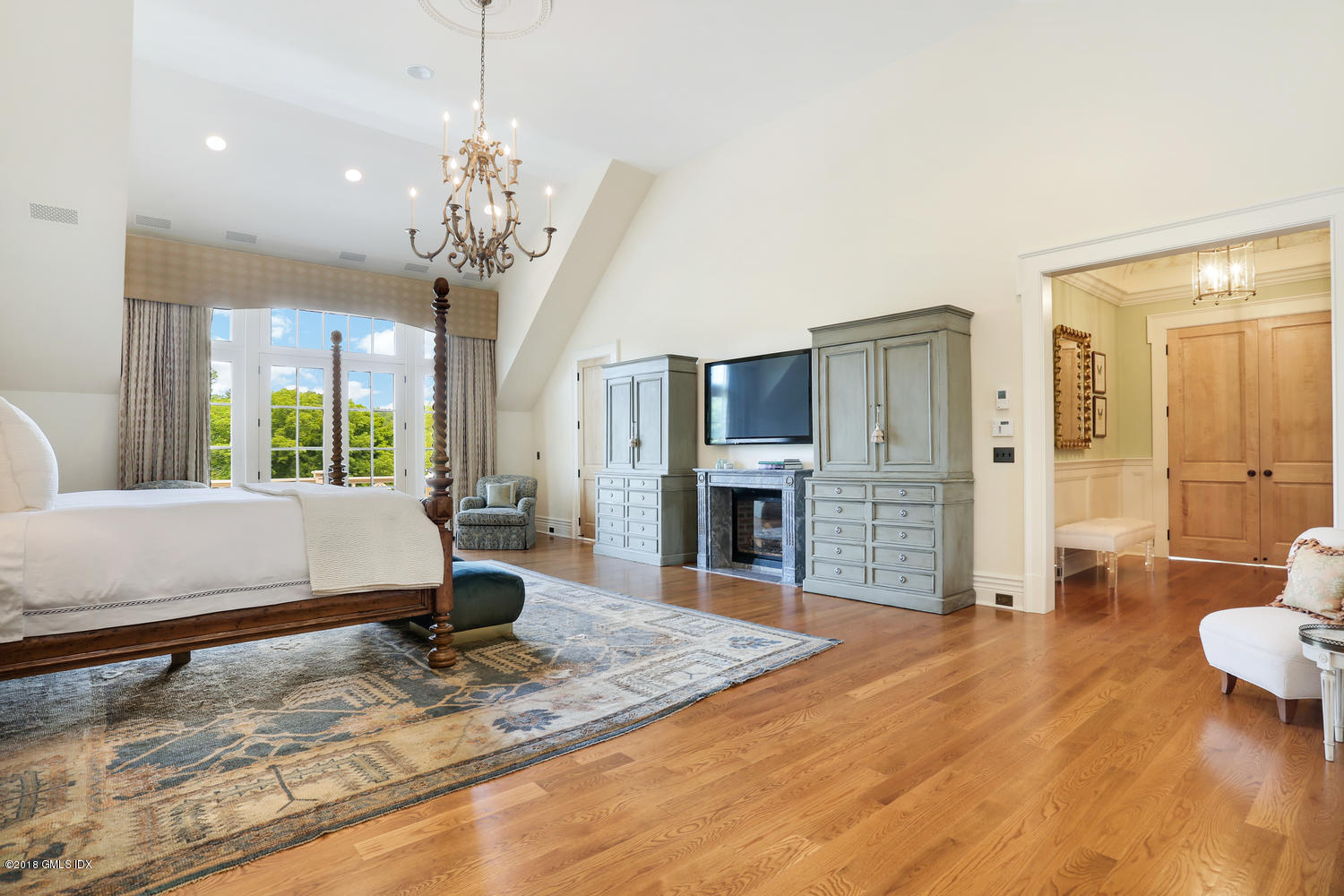35 Close Road Greenwich, CT 06831 - Photo 36 of 78 a living room with fireplace furniture and a chandelier
