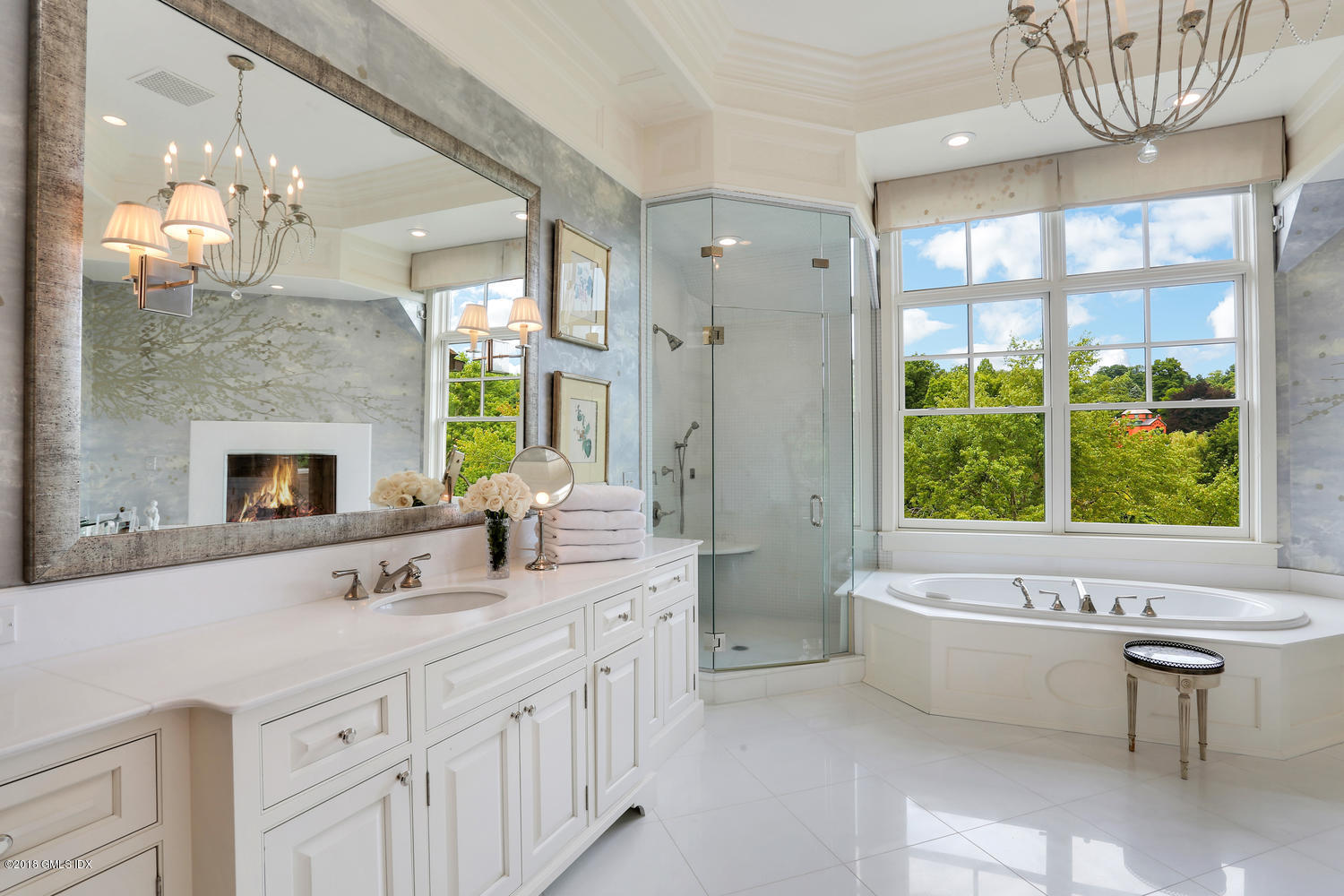 35 Close Road Greenwich, CT 06831 - Photo 38 of 78 a bathroom with a double vanity sink large mirror and a bathtub