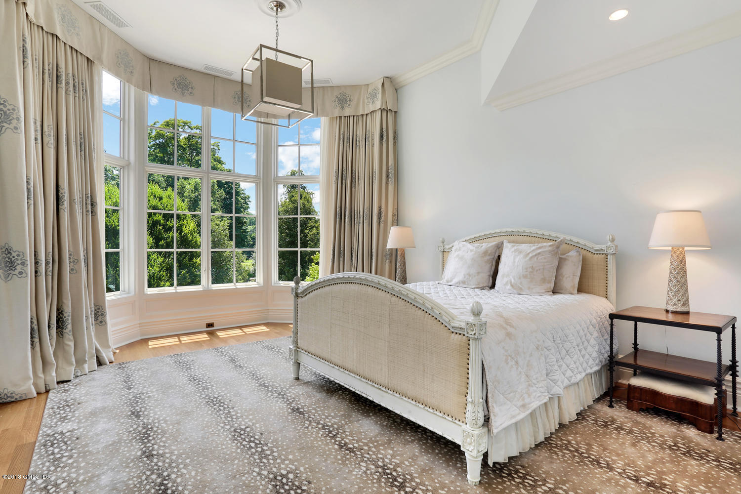 35 Close Road Greenwich, CT 06831 - Photo 43 of 78 a spacious bedroom with a bed mirror and window