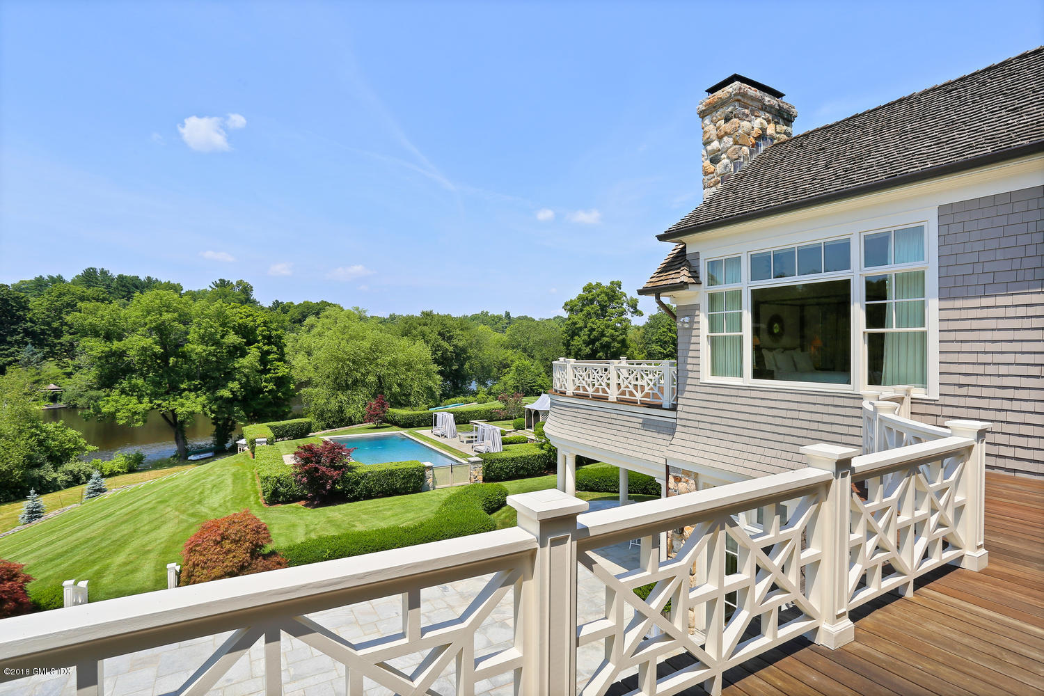 35 Close Road Greenwich, CT 06831 - Photo 45 of 78 a balcony with wooden floor and outdoor seating