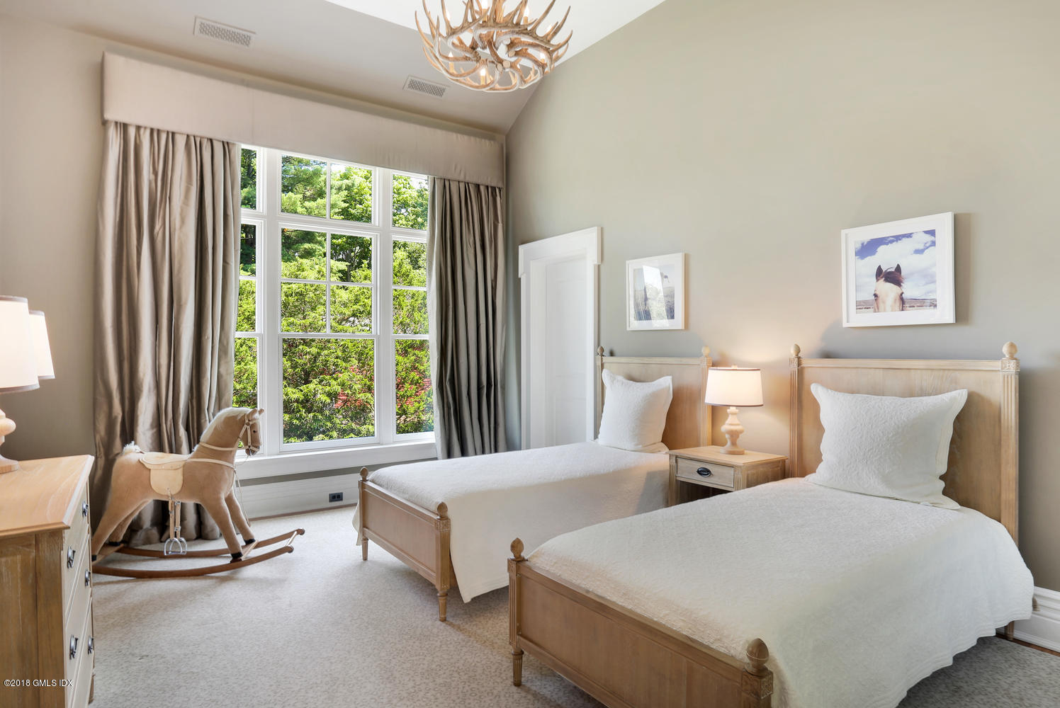 35 Close Road Greenwich, CT 06831 - Photo 47 of 78 a bedroom with two beds and a large window