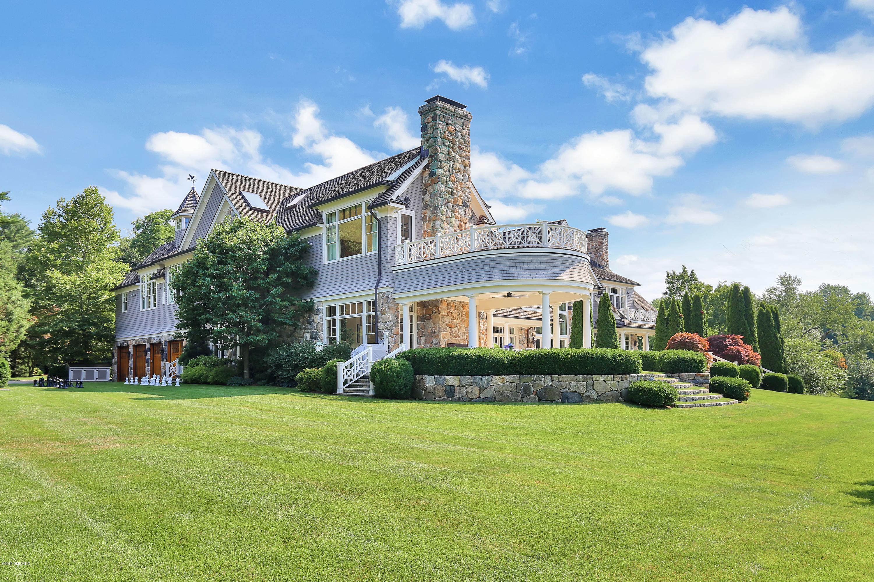 35 Close Road Greenwich, CT 06831 - Photo 58 of 78 a front view of a house with garden