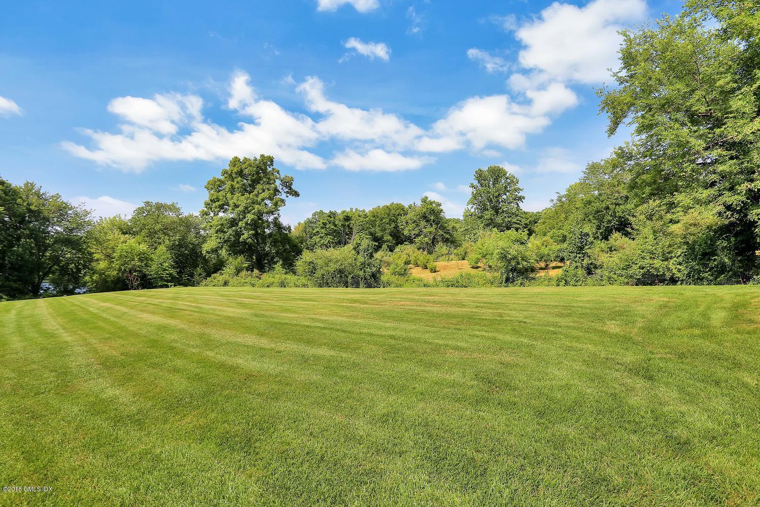 35 Close Road Greenwich, CT 06831 - Photo 59 of 78 a view of a big yard with lots of green space