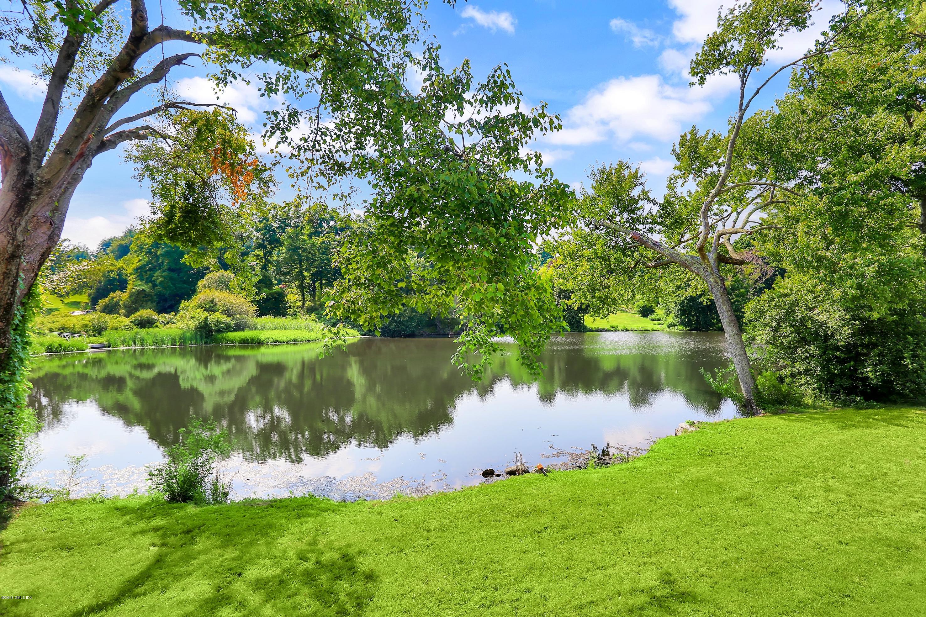 35 Close Road Greenwich, CT 06831 - Photo 63 of 78 a view of a lake with a park