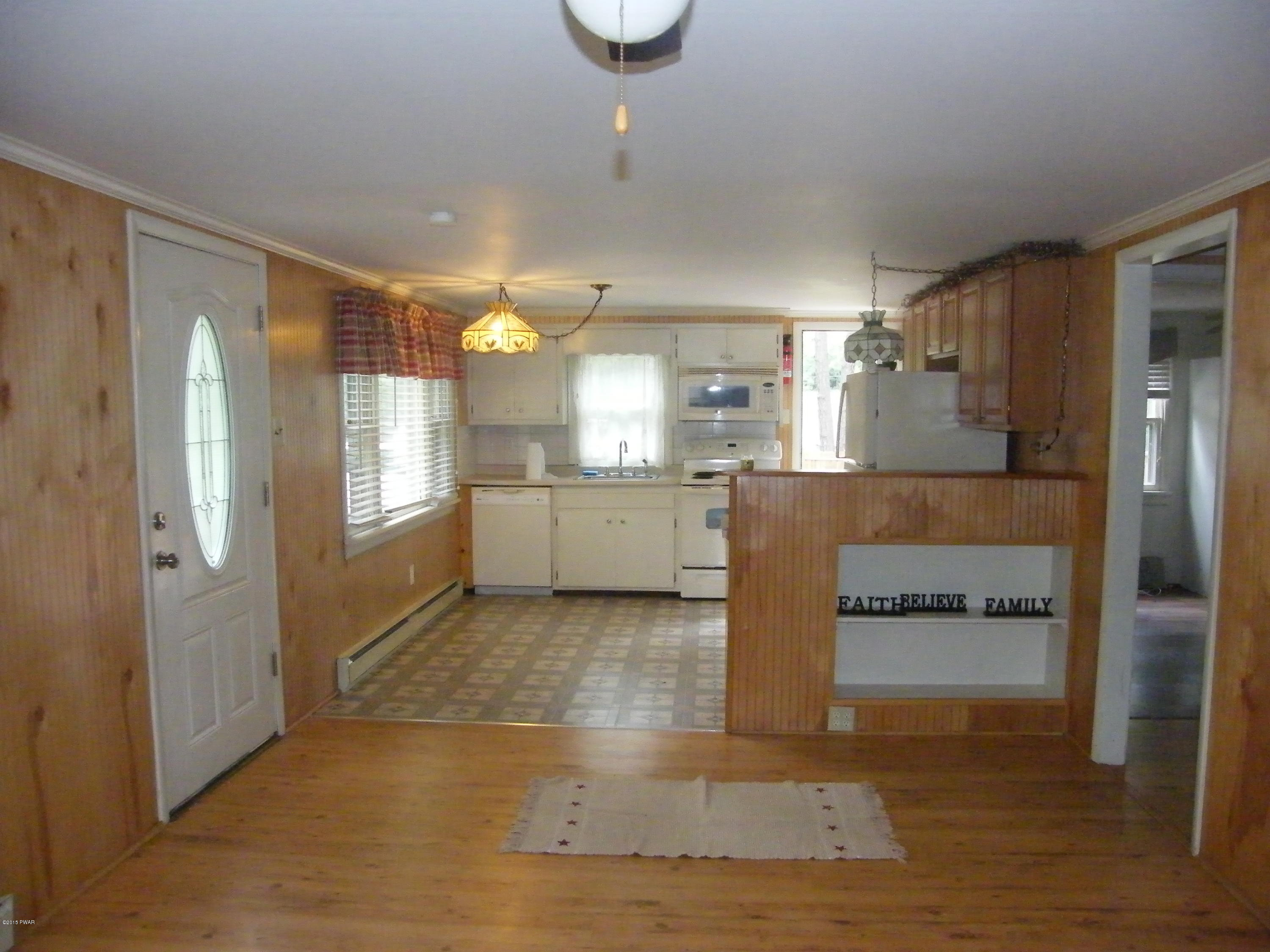 108 Tower Road Dingmans Ferry, PA 18328 - Photo 9 of 16 Open concept kitchen-living room